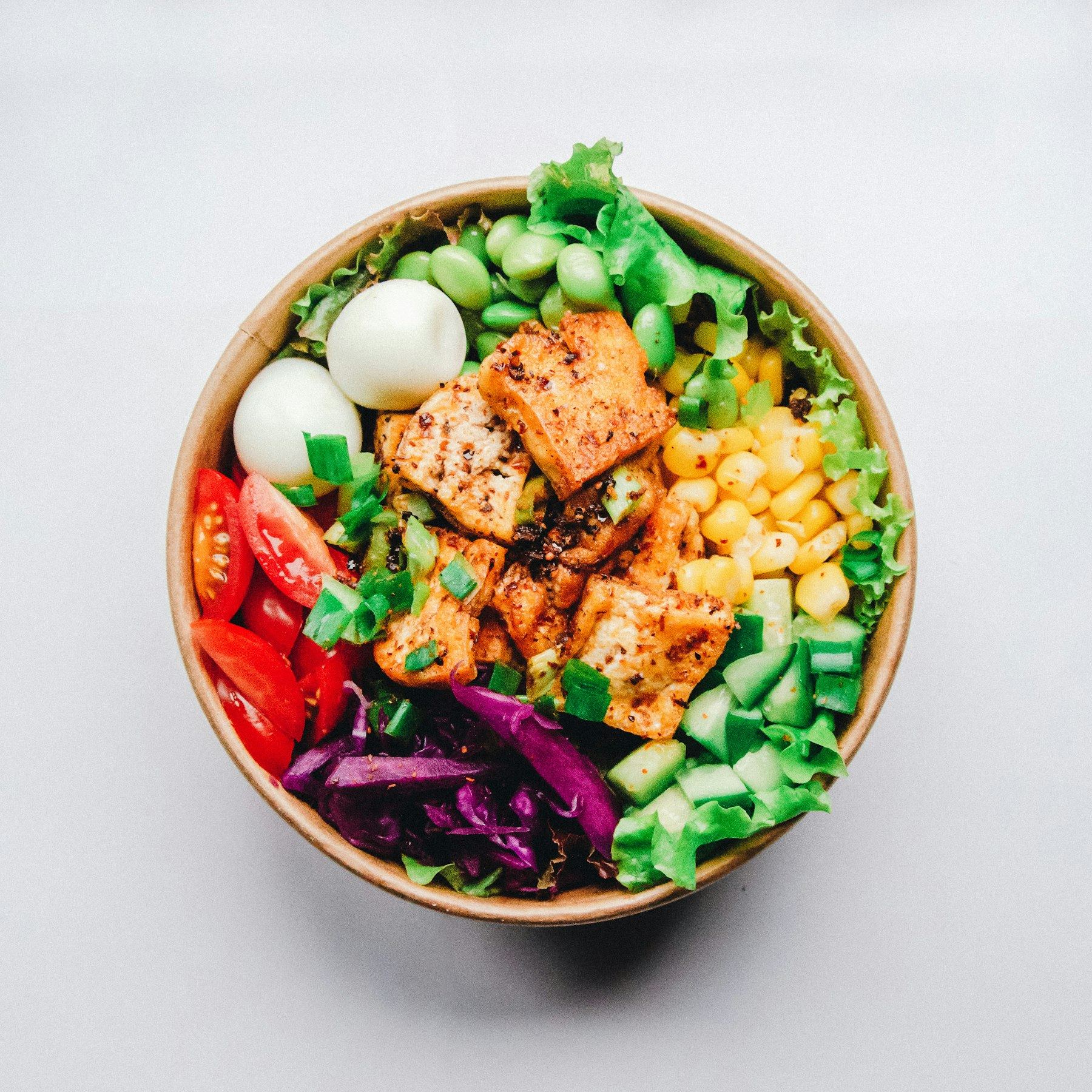 Colorful salad bowl with eggs and avocado