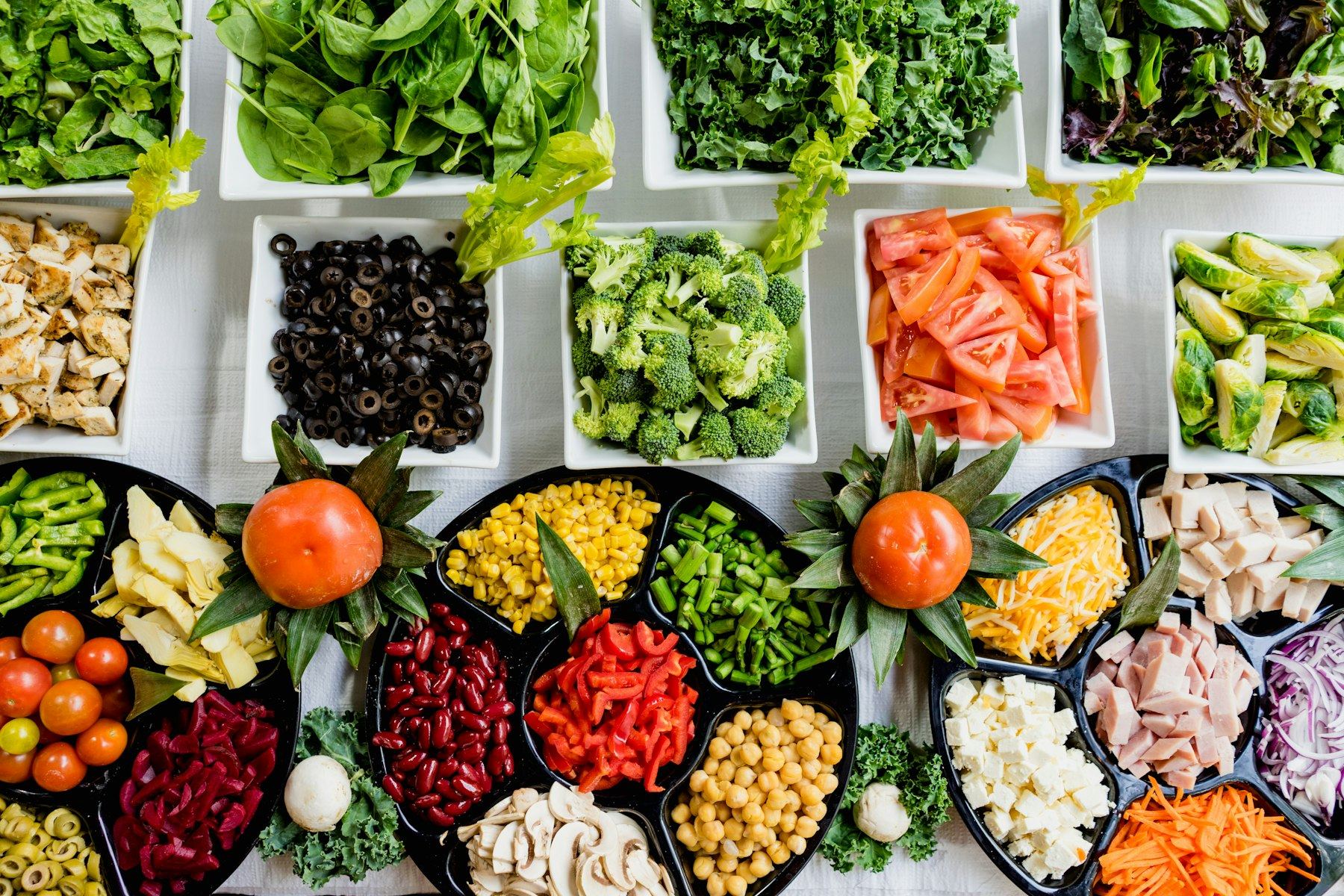 Meal prep bowls of fresh vegetables and grains